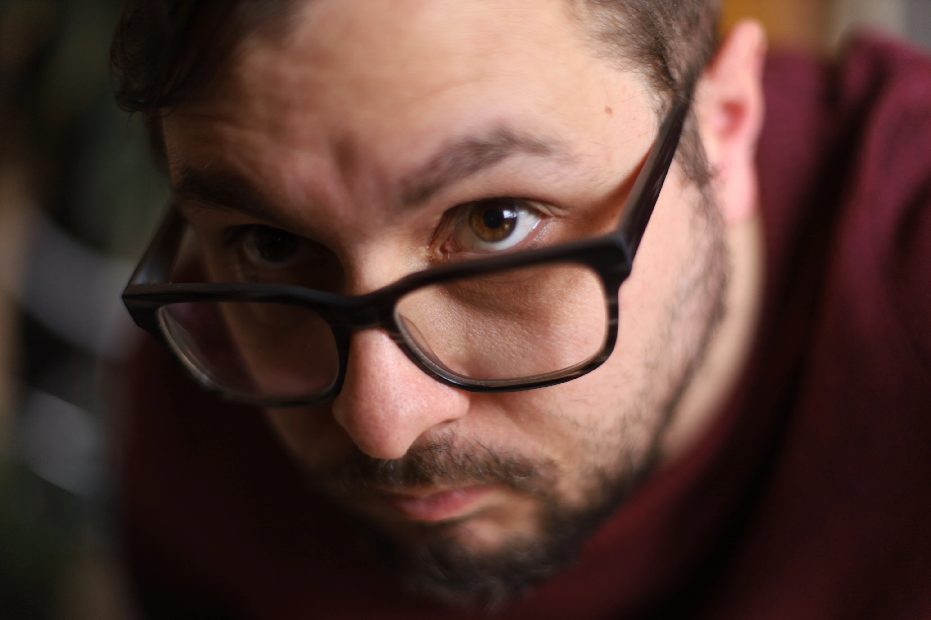 Self portrait, an intense facial close up with depth of field focused on one eye, while testing a new camera lens